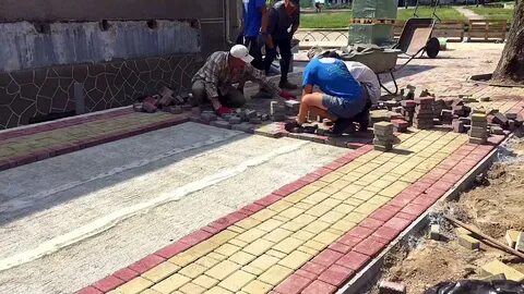 Строительные укладка тротуарной плитки