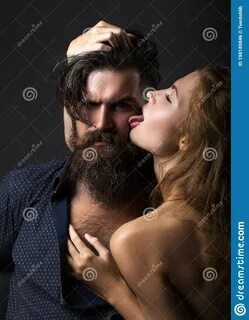 Photo about Woman licks man. 