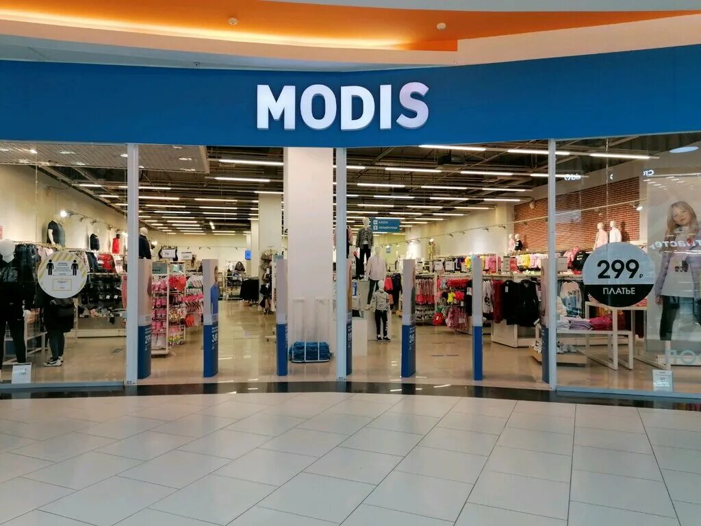 Значок модис магазин. Модис вывеска. Модис одежда. Каталог одежды. Витрина модис.