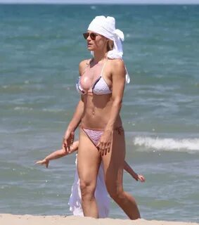 Michelle Hunziker shows off her sweet ass on the beach in Italy, 07/02/2017...