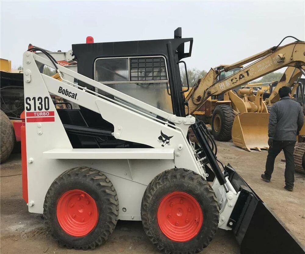 Мини погрузчик s18 bobcat. Бобкэт китайский аналог. Китайский бобкэт. Бобкэт 750. Bobcat китайской сборки.