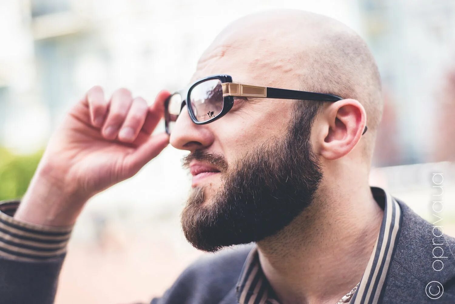 Bald Man in Mirror Sunglasses. a Beautiful Tanned Man on Vacation, Smiling. Port