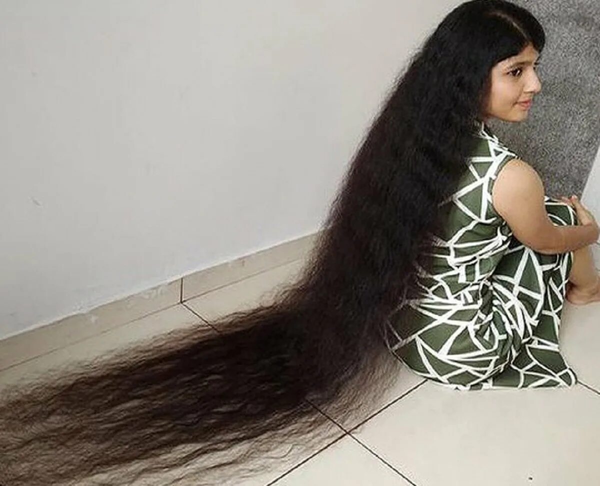 Самый высокий волос. Ниланши Патель. Самые длинные волосы в мире книга рекордов Гиннесса. Длинные волосы у ниланши Патель. Длинные волосы рекорд Гиннесса.