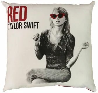 a real Taylor Swift pillow with her picture on it while wearing red sunglas...