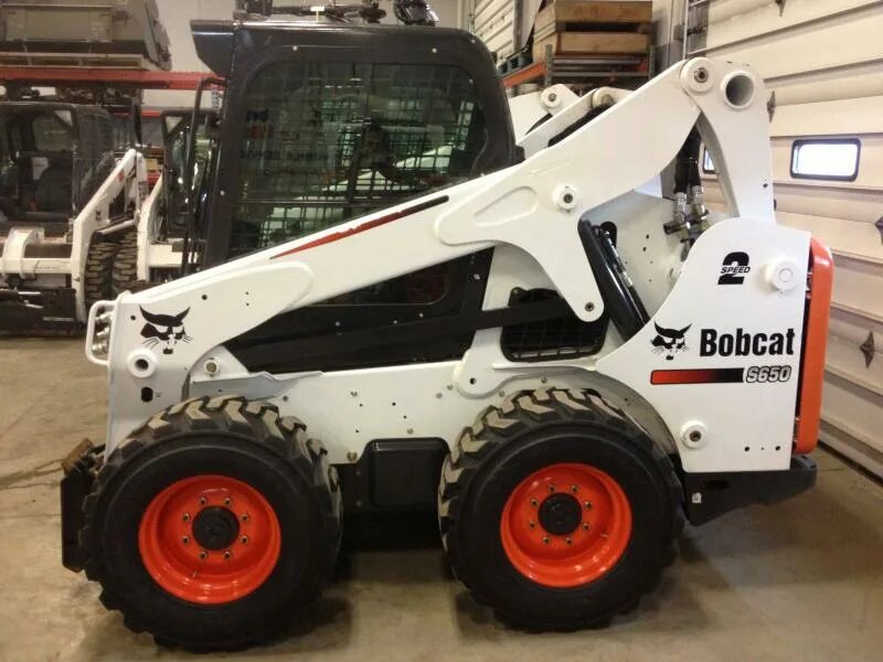 Bobcat купить bobcat pro. Погрузчик Bobcat s650. Минипогрузчик Бобкэт s650. Мини погрузчик Бобкэт 650. Погрузчик Bobcat s205..