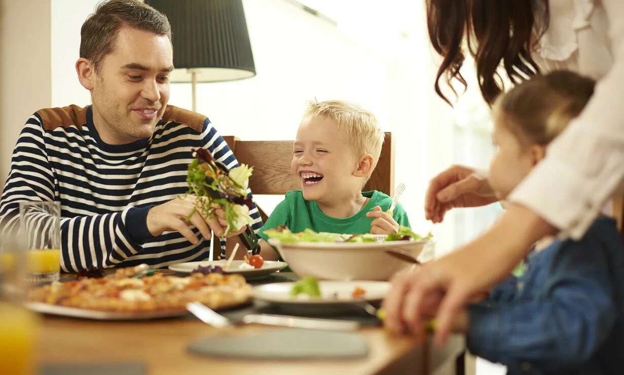 Eat out. Люди едят в кафе. Друзья на работе. Eating less. Семья кушает за столом.