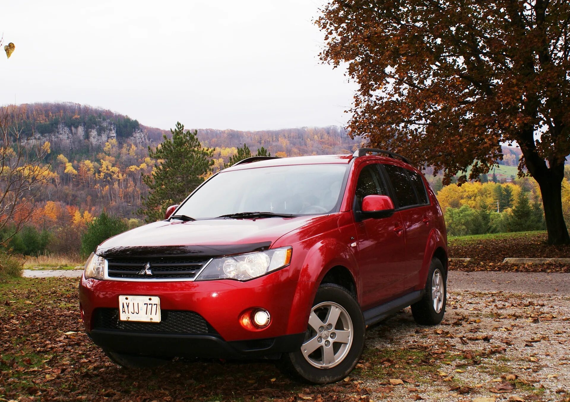 Mitsubishi outlander xl передние. Mitsubishi Outlander XL красная. Красный Аутлендер ХЛ. Аутлендер ХЛ 3.0красный. Оранжевый Outlander XL.