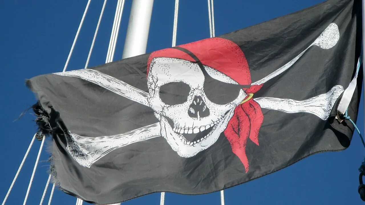 Улыбка это флаг корабля. Флаг пиратов Карибского моря. Пиратский корабль веселый Роджер. Пиратский флаг. Пиратский флаг на корабле.