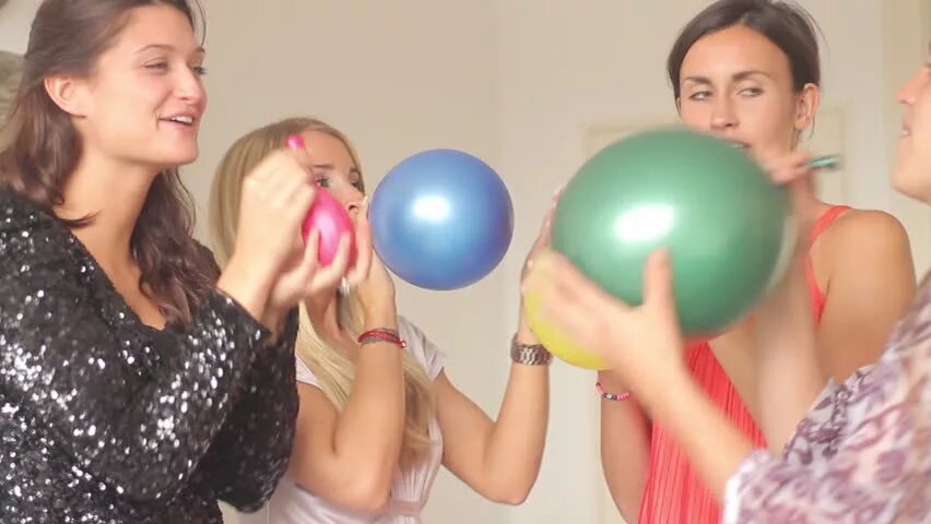 Balloon blowing up. Blowing up balloons. blow up balloons. girl blowing up balloon. girl blow to pop balloon.