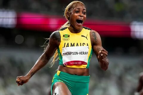 Elaine Thompson-Herah, of Jamaica, wins the women's 100-meter final at...
