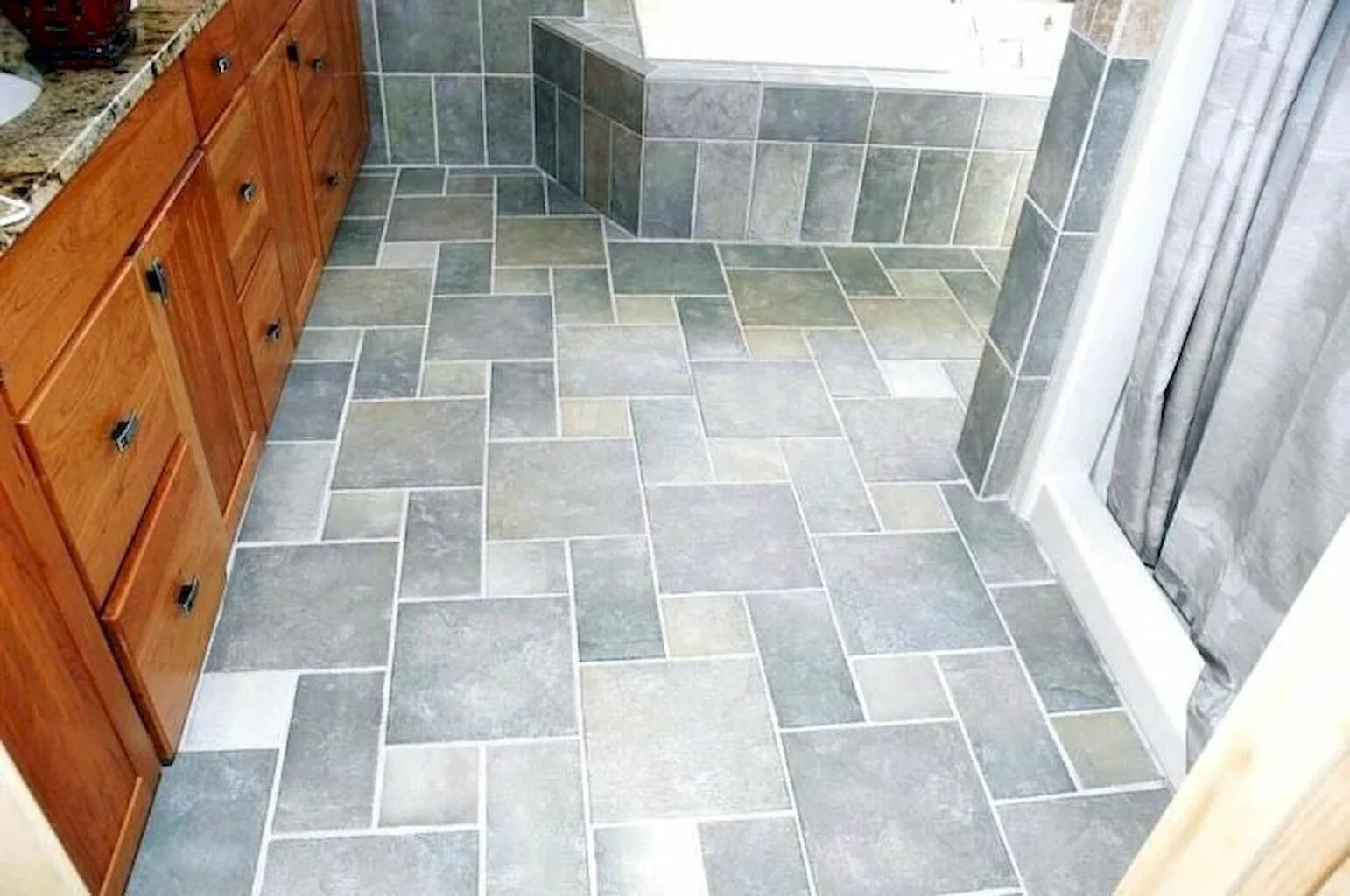 Кафельная плитка на пол для ванной. Чтобы выложить пол в ванной комнате. Чтобы выложить пол в ванной комнате. Укладка плитки на пол ванны. Плитка для пола в ванной.