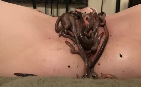 Girl puts worms in her pussy