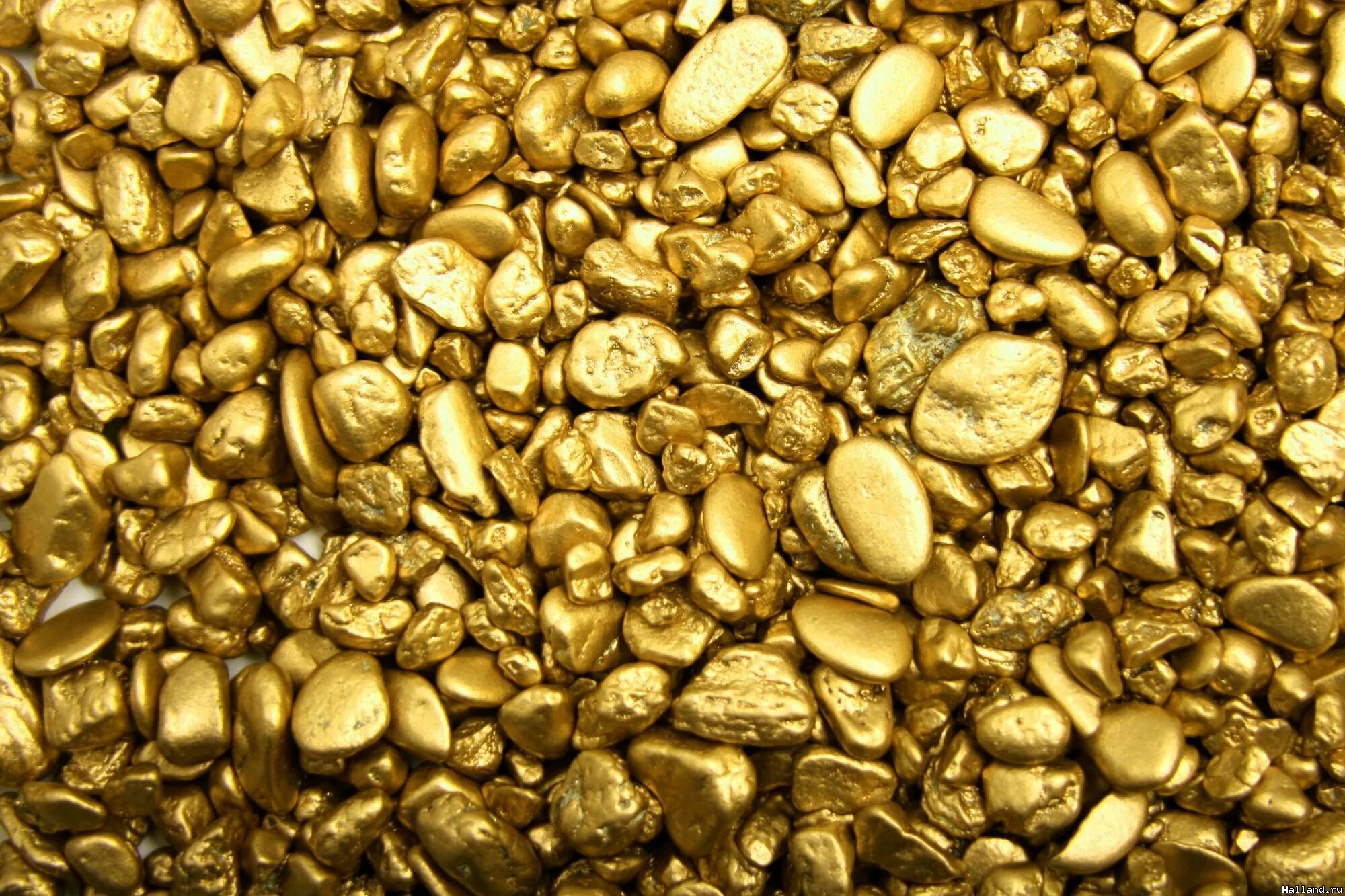 Золото. Золото камушки. Золото россыпью. Текстура золотого металла.