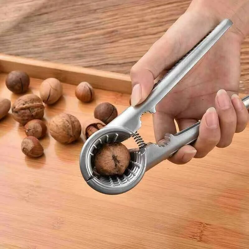 Вьетнамский орех макадамия. Ключик для открывания макадамии. Фундук раскрытый. Разбить орех. Кожица грецкого ореха.