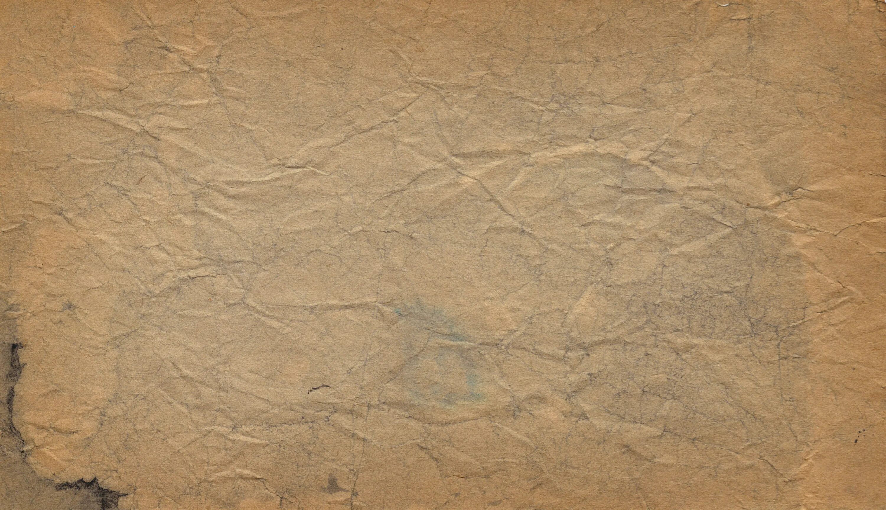 текстурная бумага. фактура старой бумаги. старая бумага. фон пергаментная бумага. мятая коричневая бумага.