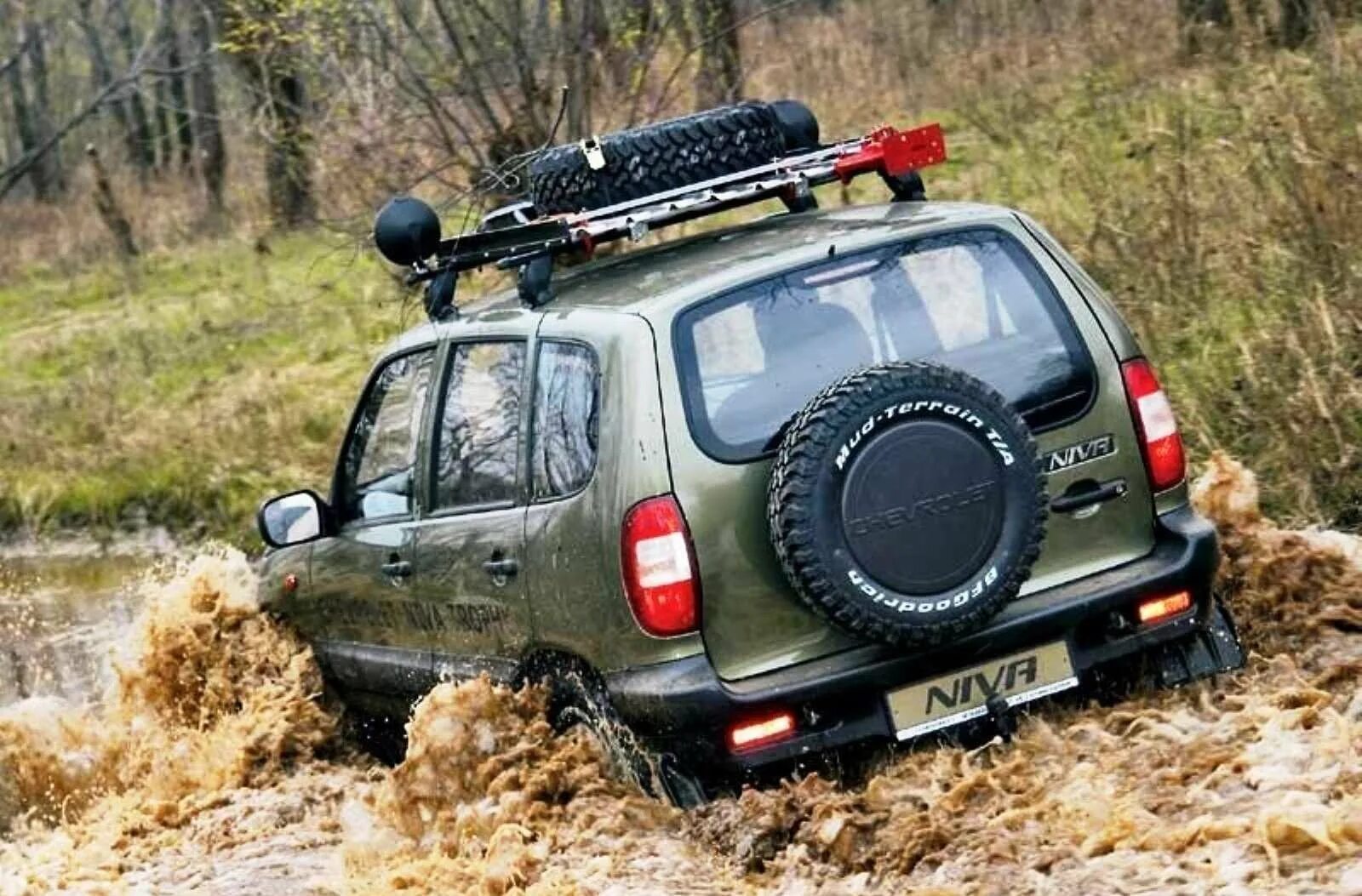 Шнива установка. Нива Шевроле 4х4 оффроад. Нива Шевроле 4 на 4. Niva Chevrolet Offroad Tuning. Chevrolet Niva Trophy (Шевроле Нива трофи).