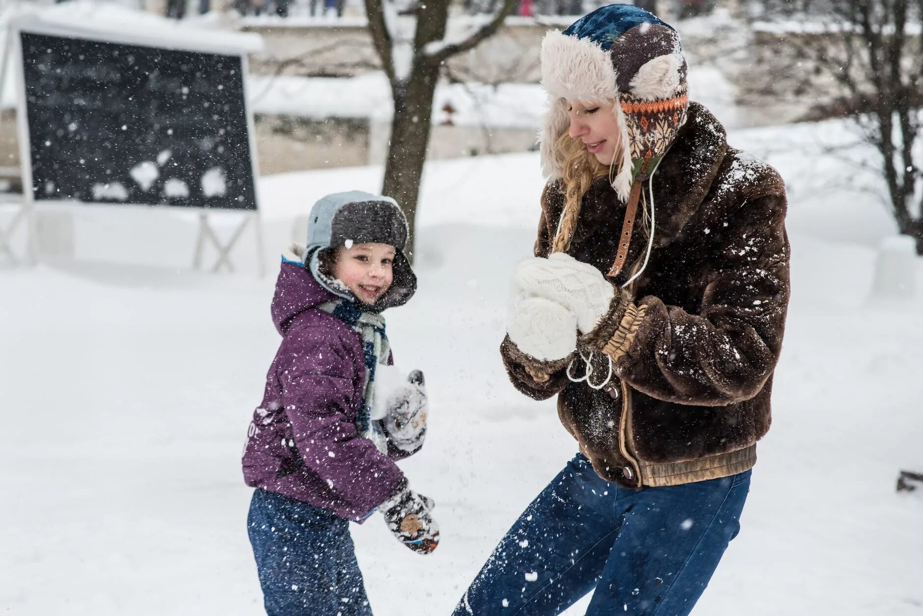 Child playing in the snow