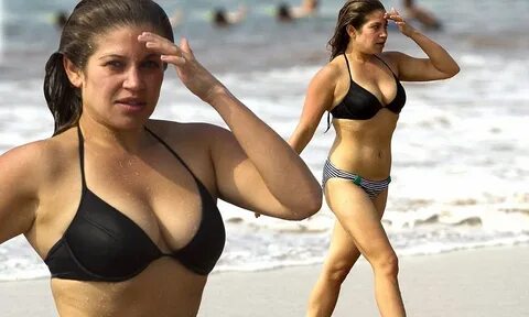 Body-confident Danielle Fishel sheds her inhibitions as she slips into a bi...