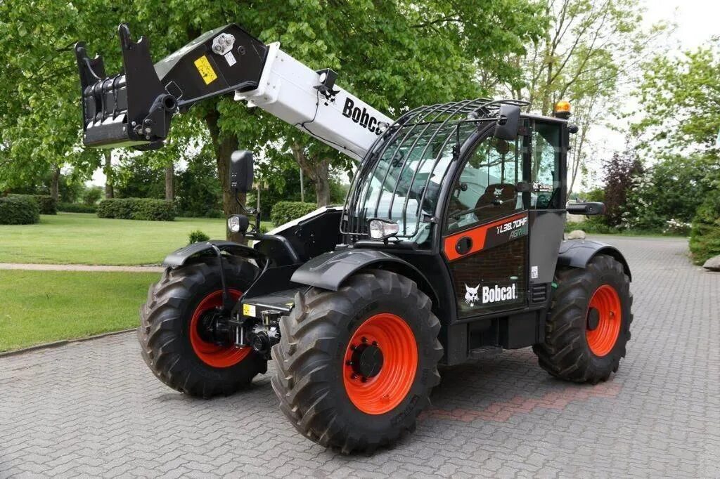 Bobcat телескопический. Bobcat TL38.70HF. Телескопический погрузчик Бобкэт. Bobcat TL38.70. Телескопический погрузчик Bobcat т35140s.