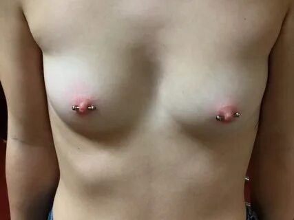 Nipple piercings on small boobs.