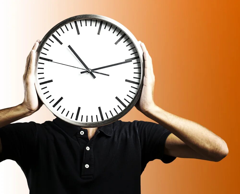 Стоп час. Человек с часами. Человек держит часы. Что такое пунктуальность в человеке. Стоковые изображения часы.