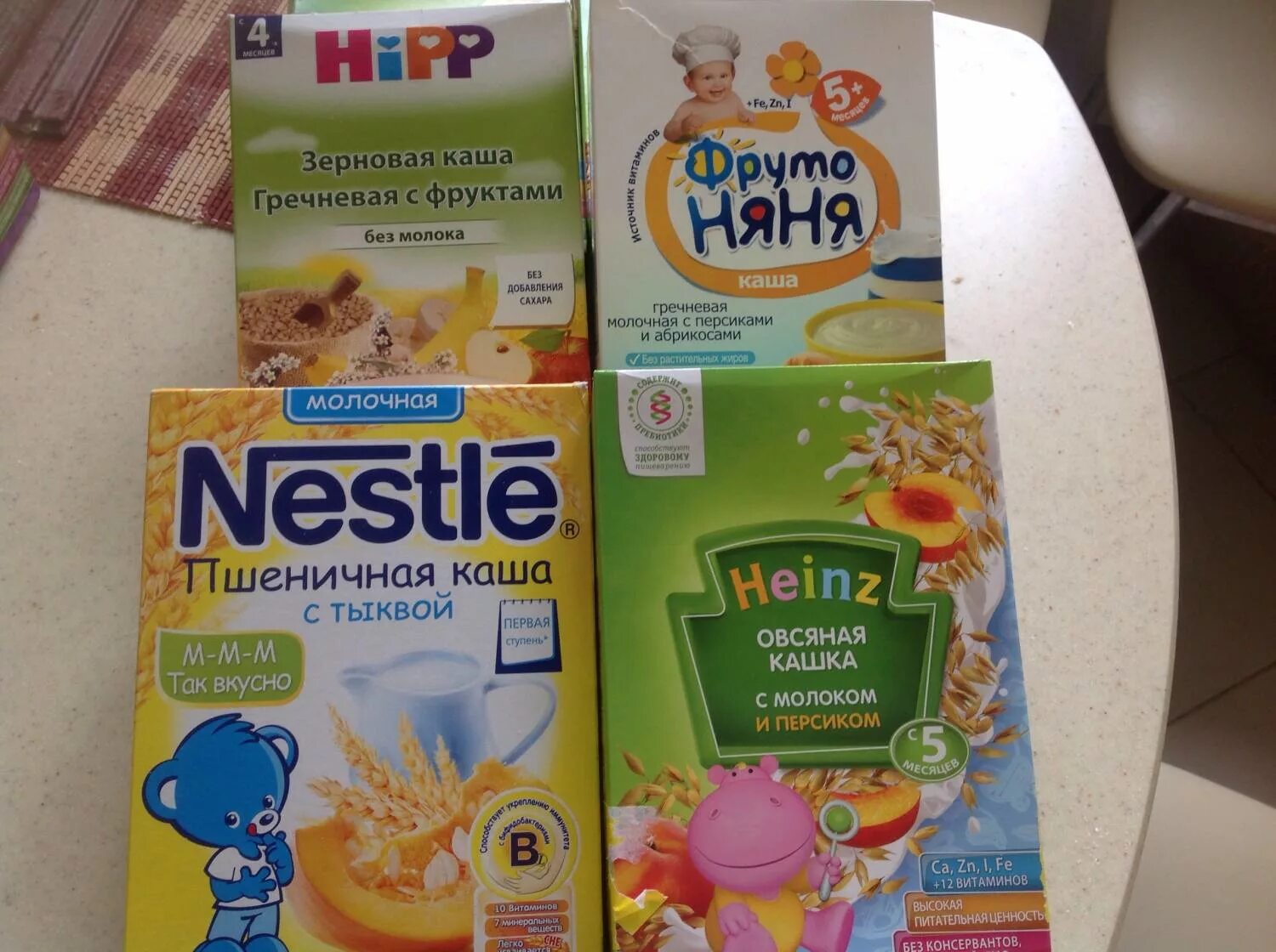 детские каши до года. каша хипп овсяная безмолочная. каши до года. каша нестле молочная овсяная. каша умница молочная овсяная.