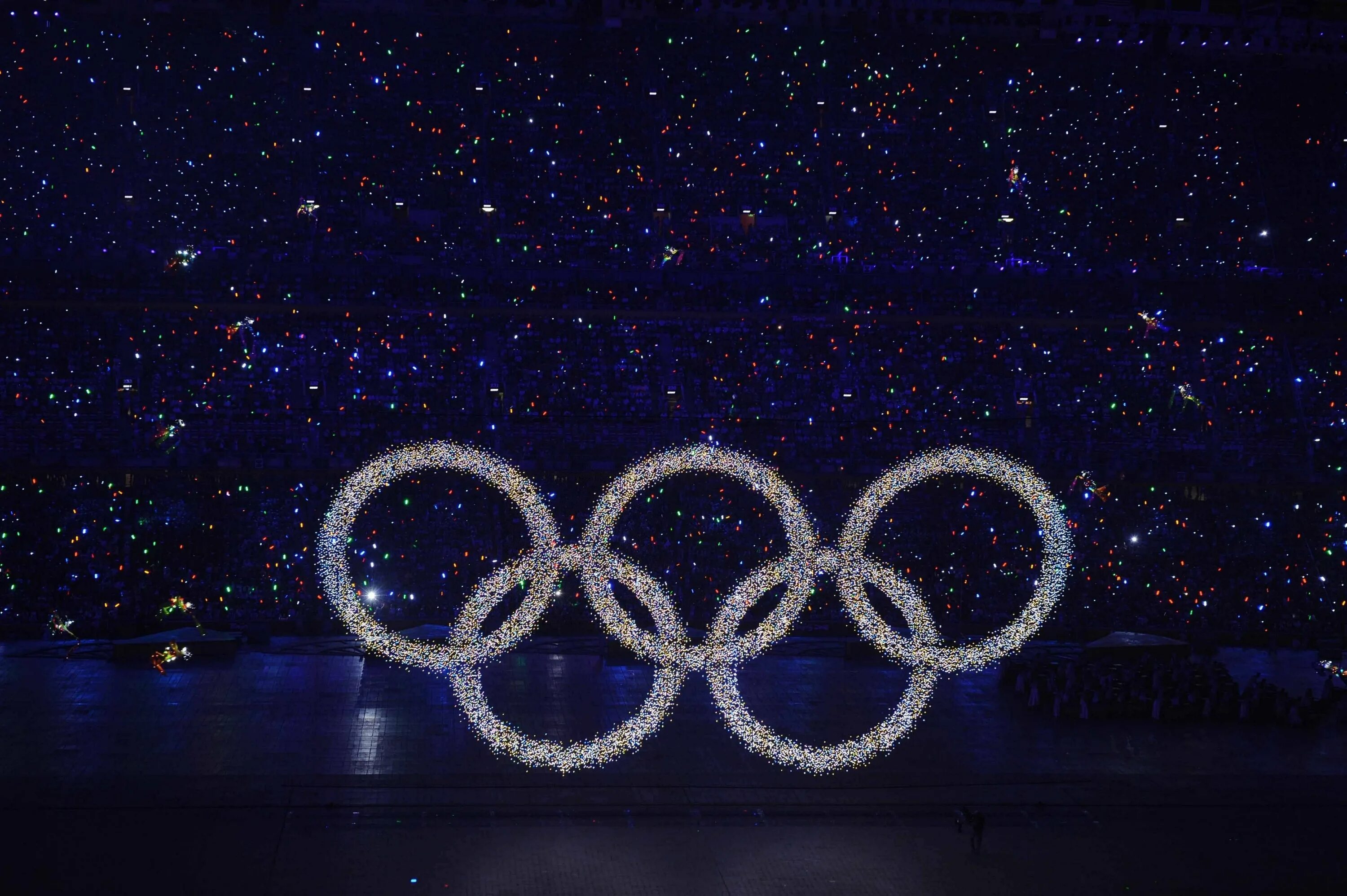 Олимпийские игры т. Олимпийские кольца. Кольца Олимпийских игр. Черное олимпийское кольцо. Олимпийские кольца на черном фоне.