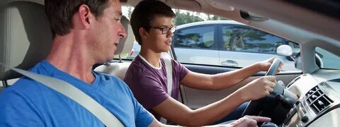 teaching driving to teenager boy
