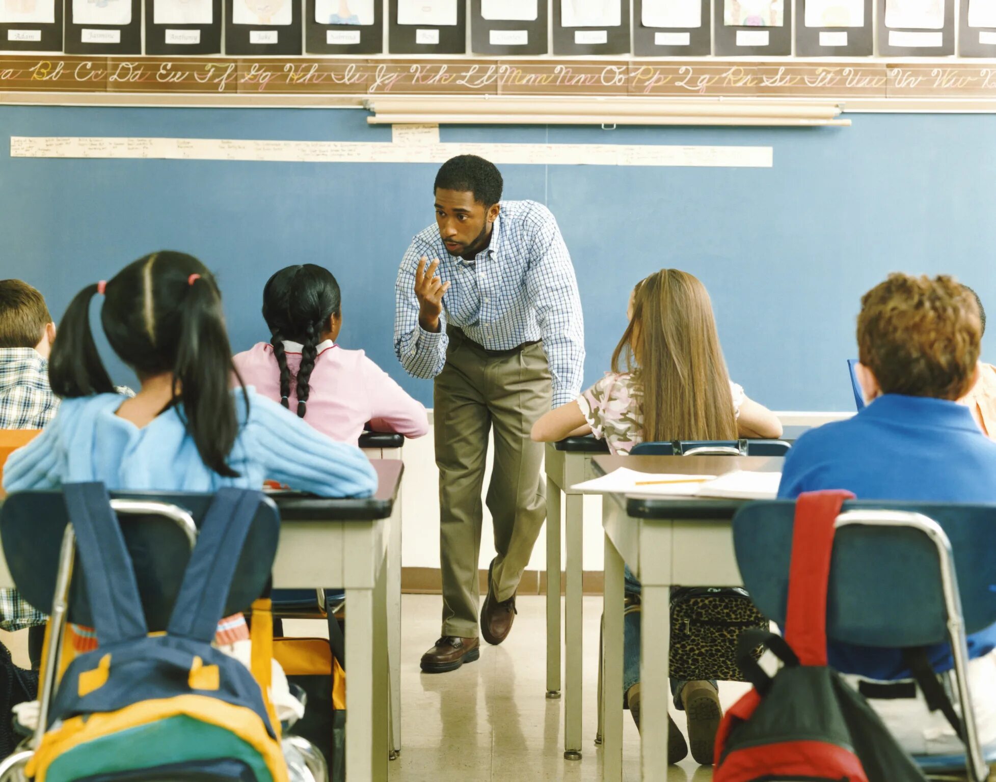 School teach. Американские учителя. Учитель в США. Учитель в американской школе. Школа в Америке учителя.