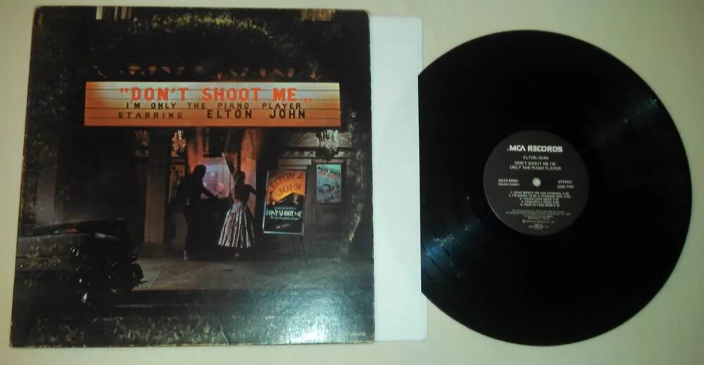 Don t shoot piano player. Элтон Джон the one винил. Don’t shoot me i’m only the Piano Player Элтон Джон. Crocodile Rock Elton John обложка. Elton John 1973 don't shoot me, i'm only the Piano Player Vinyl.