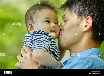 Japanese father and son at the park Stock Photo. 