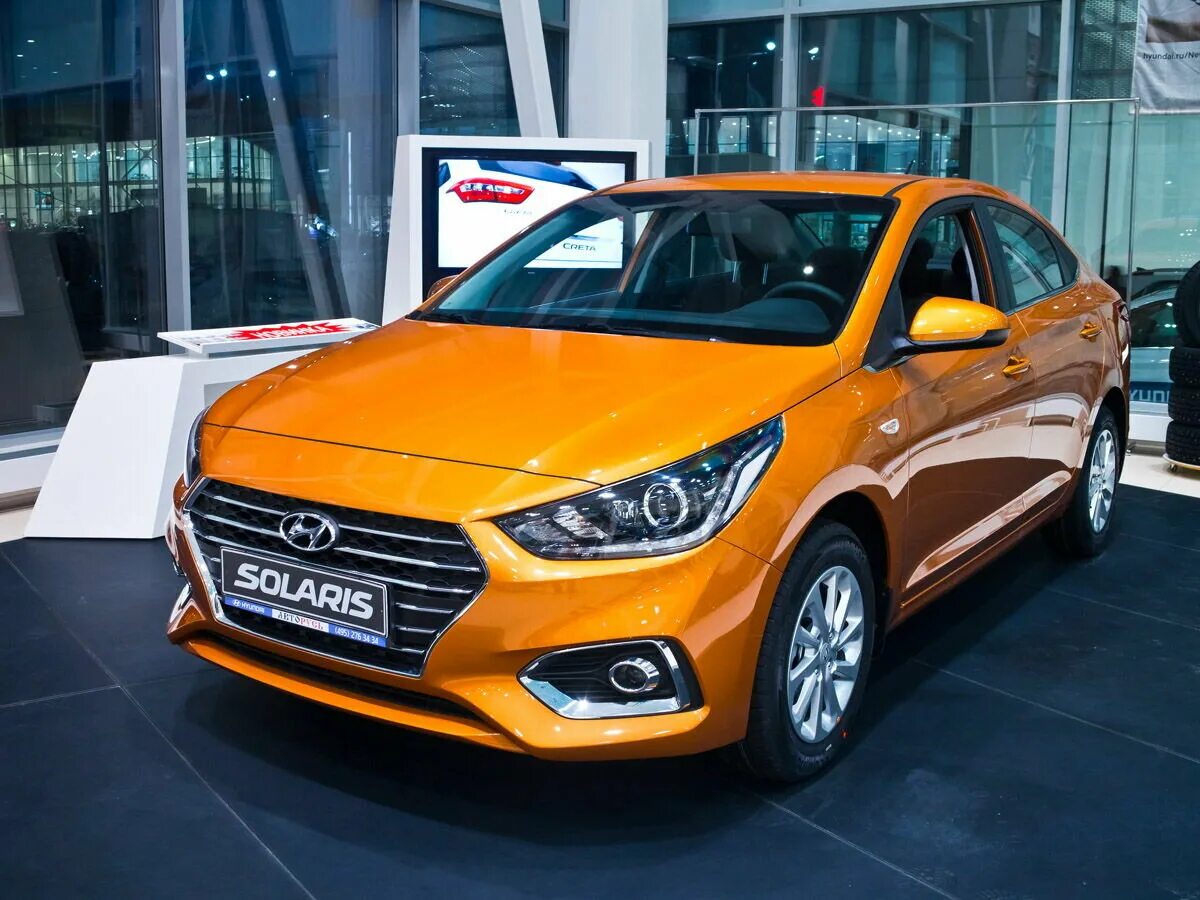 Хендай солярис новый 1.6. Hyundai Solaris II 2017. Хендай Солярис 2021 оранжевый. Hyundai Solaris 2017 оранжевый. Хендай Солярис 2018 оранжевый.