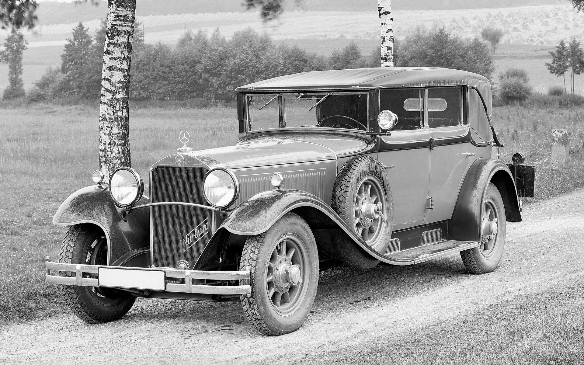 Первые немецкие автомобили. Mercedes Benz 1923. Mercedes-Benz w153. Mercedes-Benz 460 Nurburg 1928. Даймлер Бенц 1920.