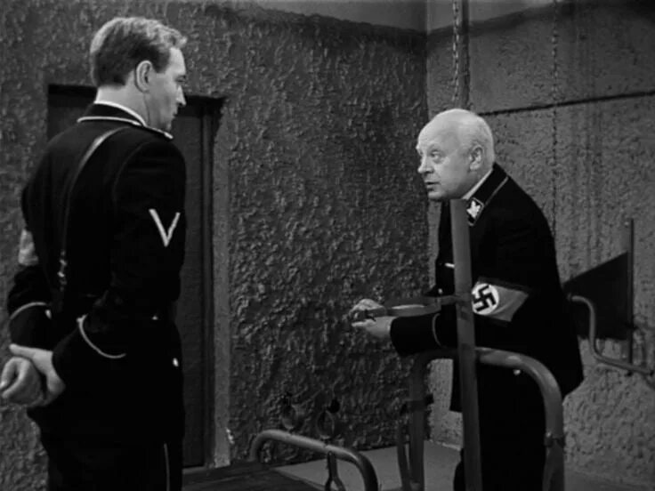 Шолохов судьба человека презентация. Поединок с мюллером судьба человека. Штирлиц в гестапо у мюллера. Почему на допросе у мюллера. Как зовут коменданта лагеря?.