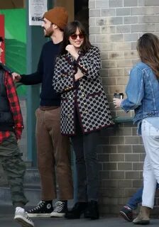 Dakota Johnson Donning Round Black Velvet Lace-Up Boots While Out And About...