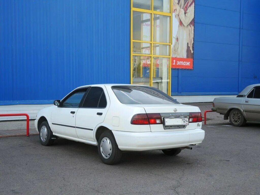 Ниссан санни иркутск. Nissan Sunny b14. Nissan Sunny b14 белый. Ниссан Санни 14 белый. Nissan Sunny 1997.