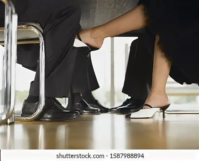 Barefoot under Table. Feet under Table. Suburban feet under Table. Footsie Table.