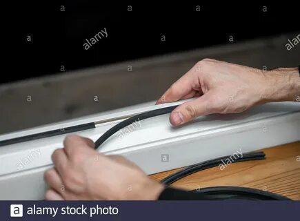 Professional master at repair and installation of windows, changes rubber seal g