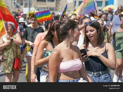 Gay And Lesbians Walking In The Gay Pride Parade. 