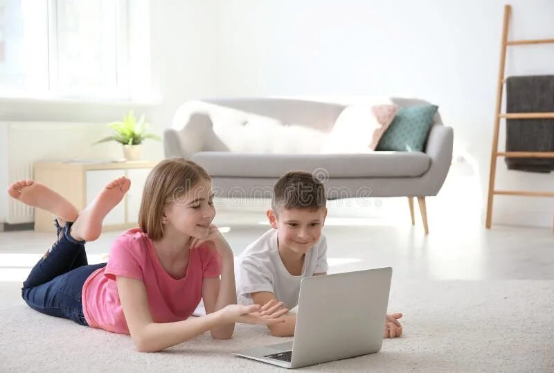 Ноутбук brother. Two boys on Bed with Laptop.