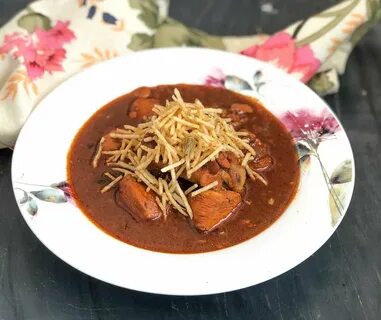 Parsi Salli Murgh is a spicy chicken curry that is typically served with po...