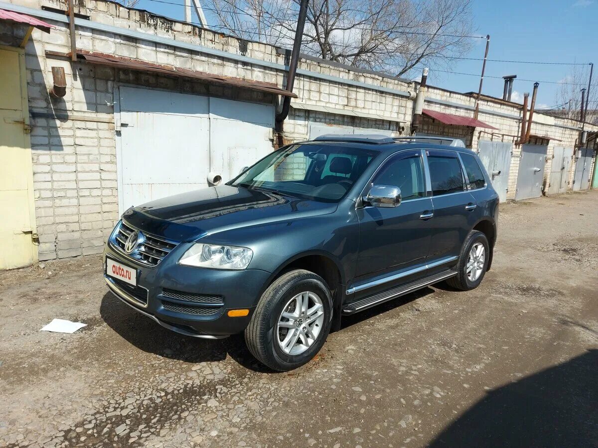 Фольксваген туарег 1 поколения 3.2 бензин. Touareg 1 поколения. Туарег 1 поколения серого цвета. Туарег 1 и Антара. Подфарники Фольксваген Туарег 1 2006 года.