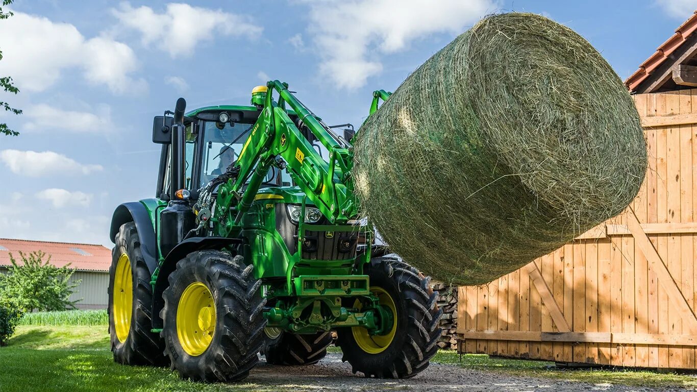 Погрузчики сена. Погрузчик навесной фронтальный John Deere. Трактор John Deere погрузчик. Джон Дир 603 р. Трактор John Deere 315 SL.