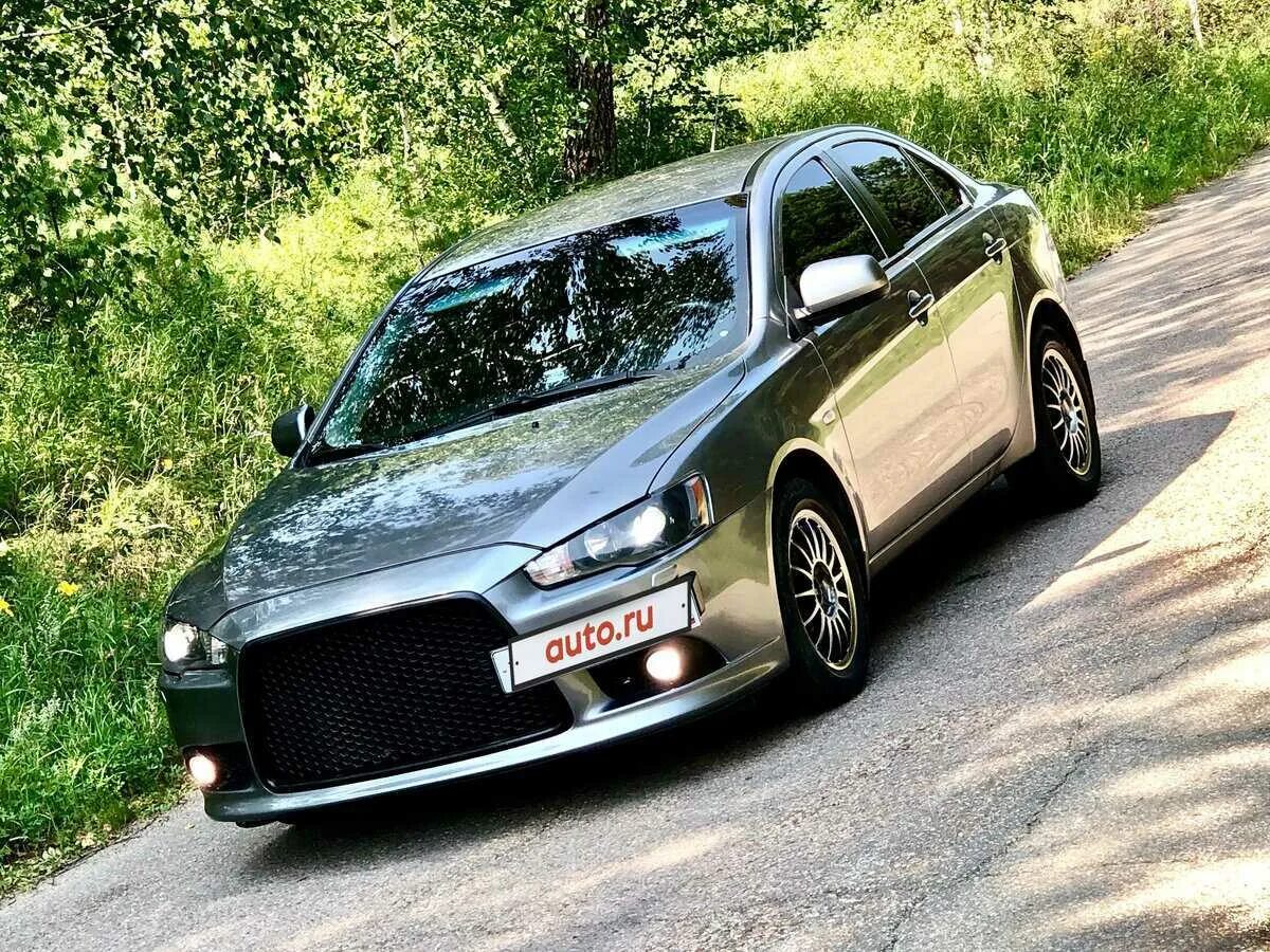 Mitsubishi lancer отзывы. Митсубиси Лансер 10. Лансер 10 Рестайлинг. Mitsubishi Lancer x Рестайлинг 2012. Митсубиси Лансер 10 Рестайлинг.