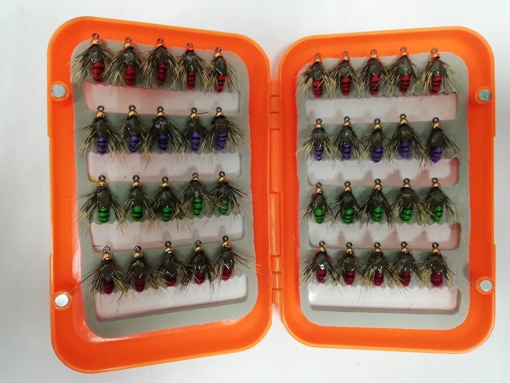 нахлыстовая муха. мушка мадлер. материал для мушек для рыбалки. инструмент для вязания нахлыстовых мушек. набор материалов для вязания мушек.