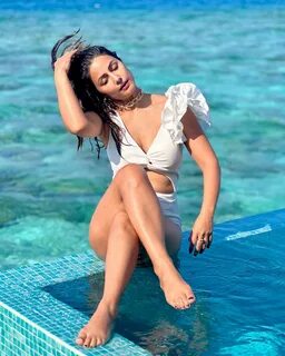 Hina Khan looks pretty in a white bikini. 