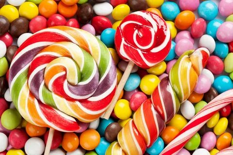 Download Swirly Lollipop And Round Candies Wallpaper | Wallpapers.com.