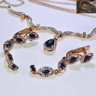 Комплект с сапфиром золотой серьги и кольцо