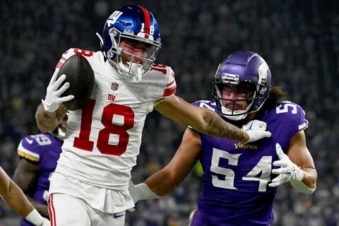 Giants wide receiver Isaiah Hodgins runs for a touchdown during the third q...