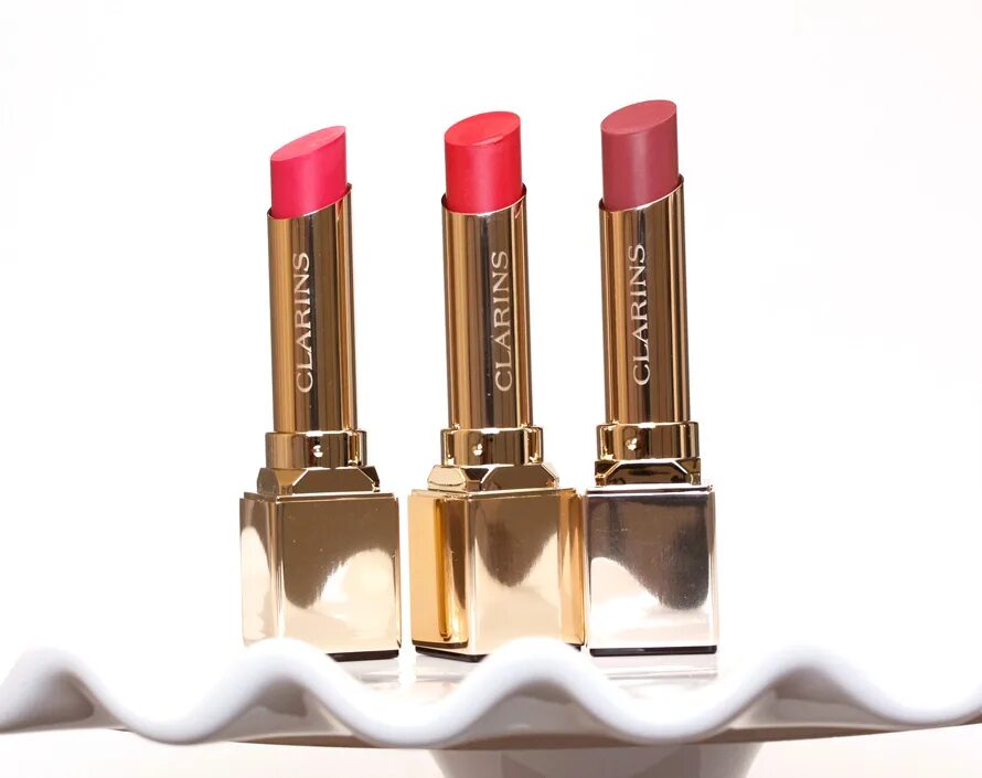 Помада для губ clarins. Clarins rouge eclat 04 tropical pink. помада кларанс 713. clarins 713 hot pink. clarins paris помада.